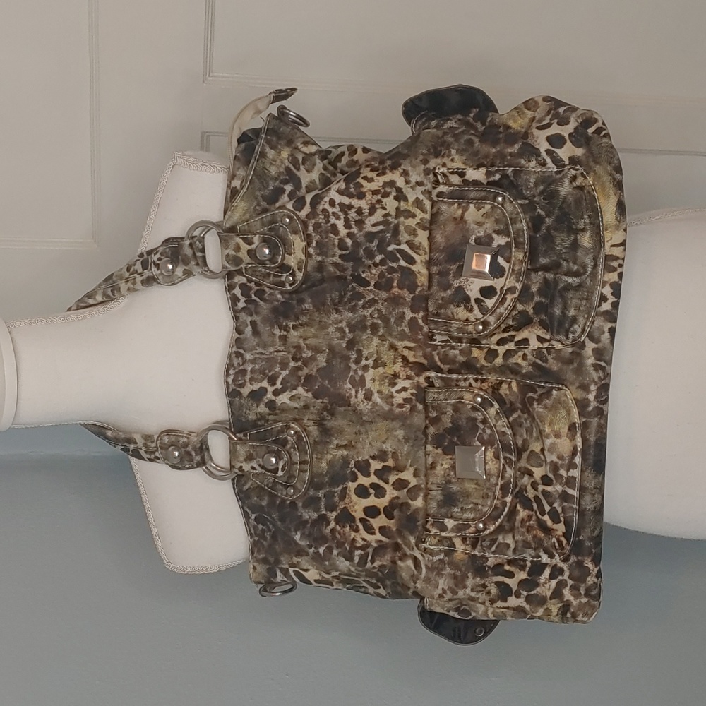 Large animal print handbag with multiple outside pockets